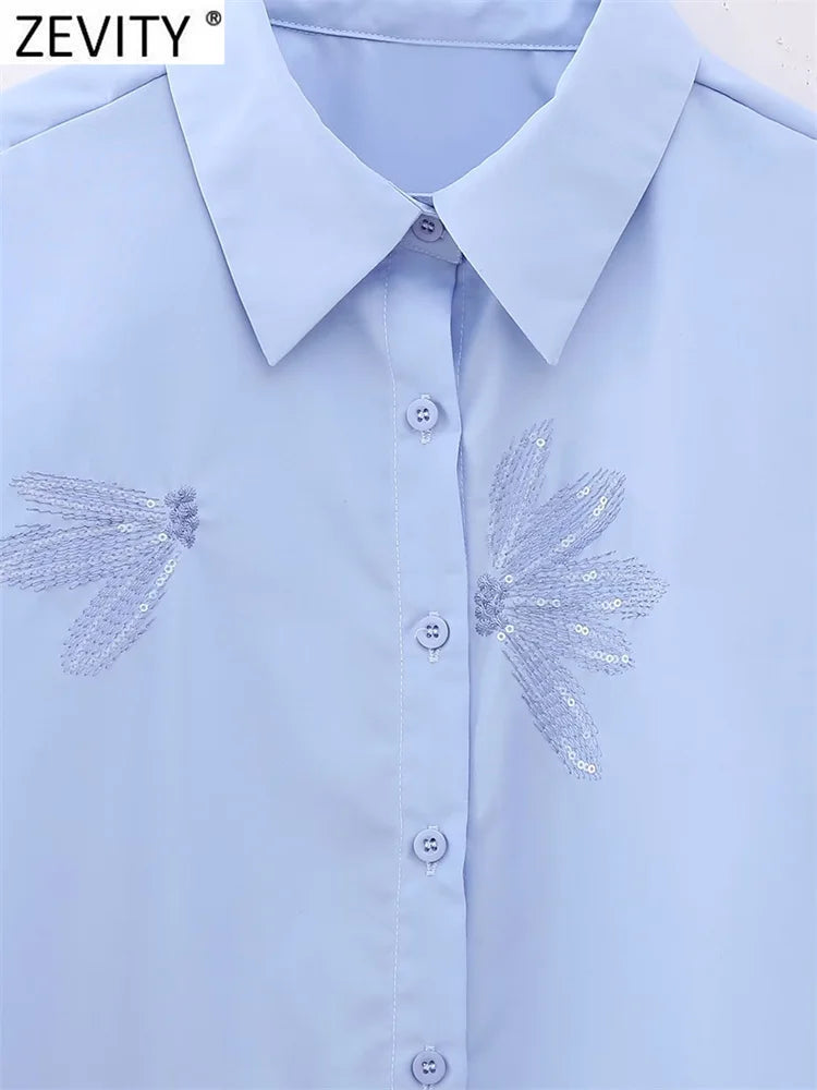 Blusa feminina fashion com bordado de flores em paetê, modelo curto estilo smock, manga longa, camisa cropped elegante para escritório