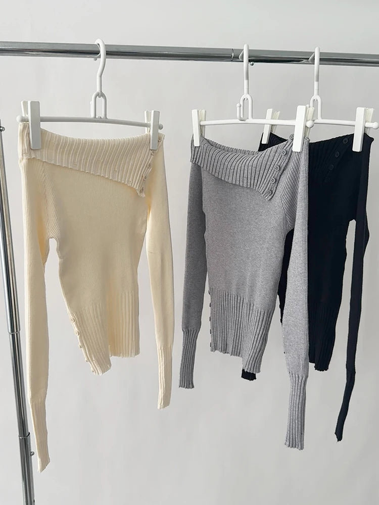 Suéter feminino preto ombro a ombro.