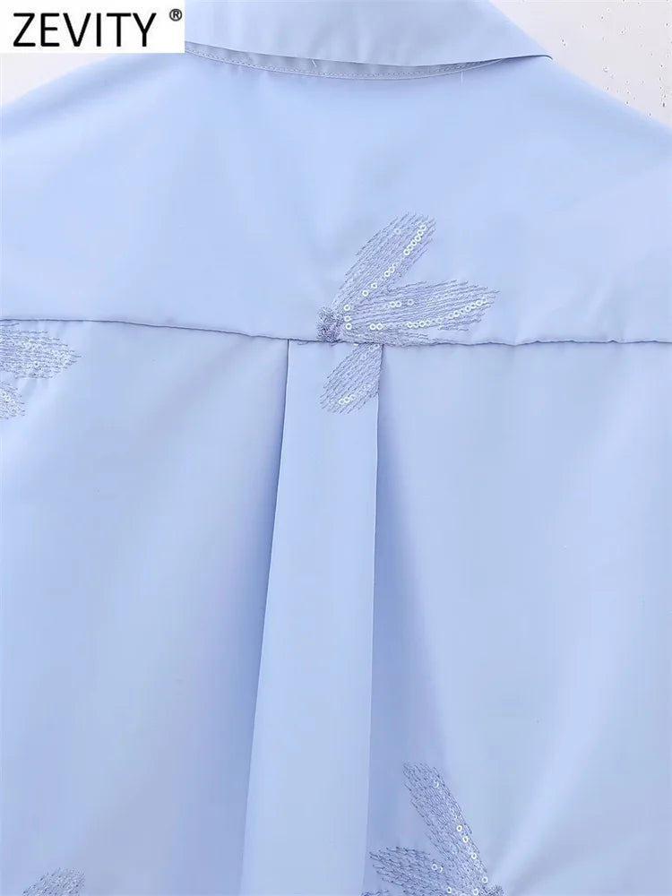 Blusa feminina fashion com bordado de flores em paetê, modelo curto estilo smock, manga longa, camisa cropped elegante para escritório